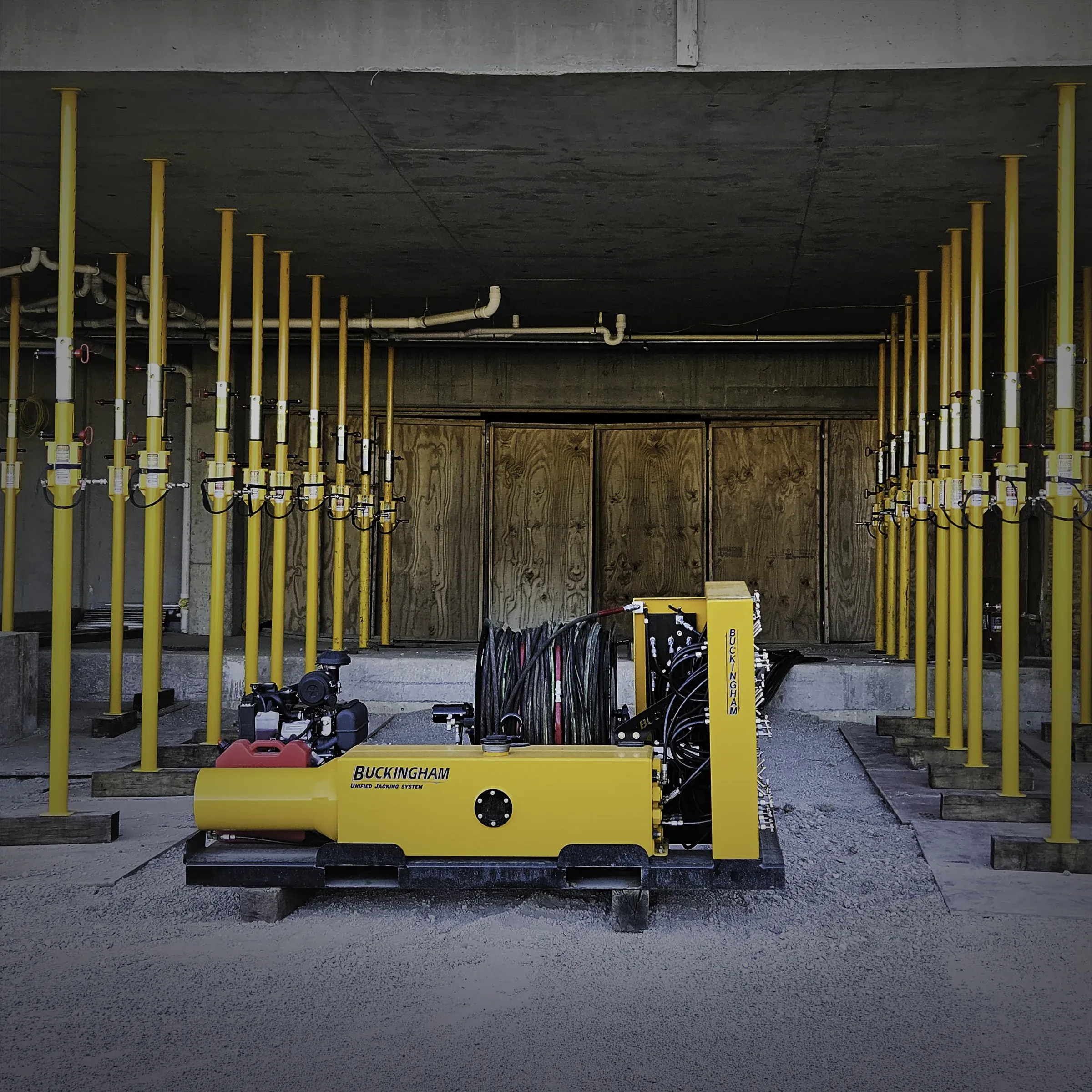 Yellow Buckingham unified jack machine with jacking-shoring posts