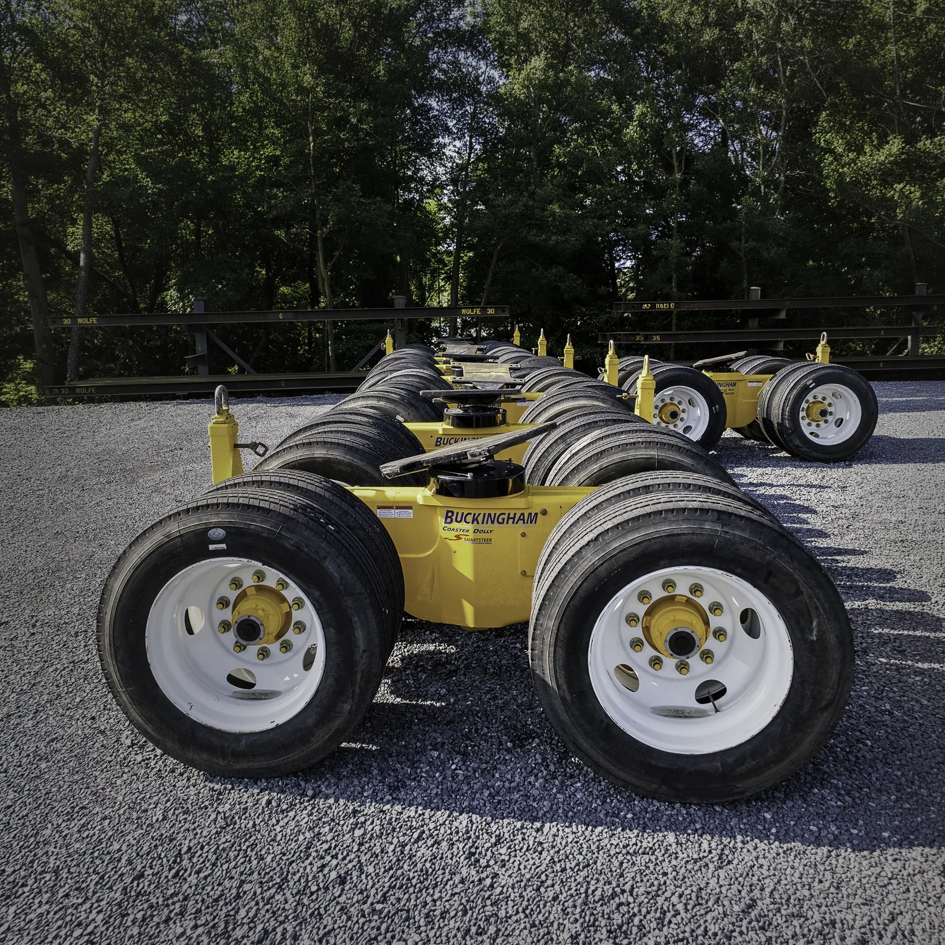 Yellow Buckingham coaster dollies lined up in a row